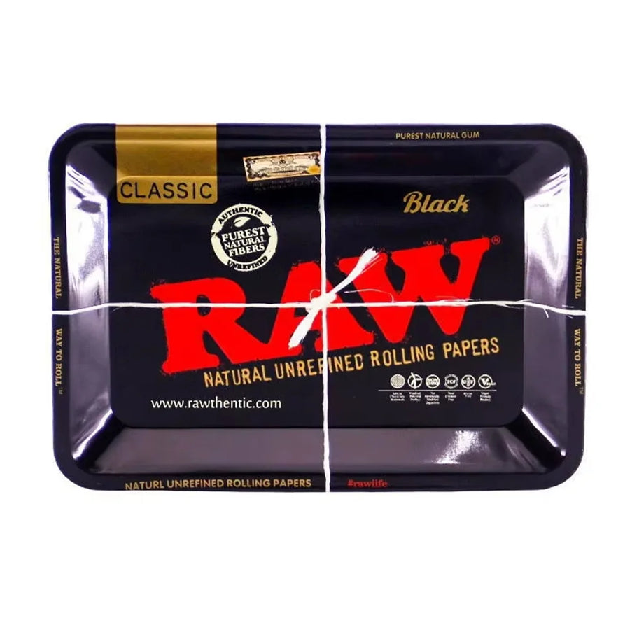 RAW rolling papers packaging with a black tray on a white background