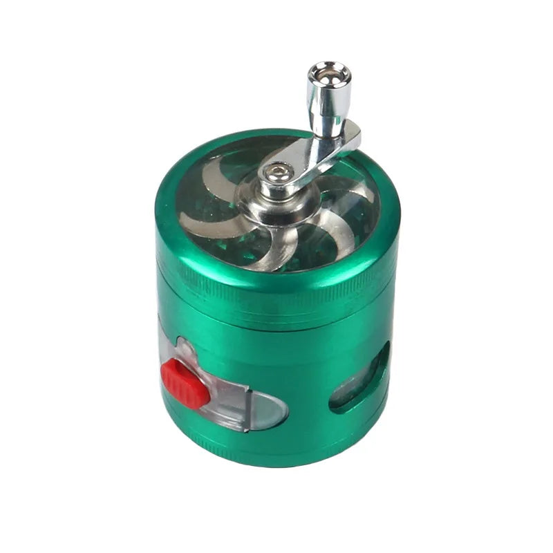 A green metal cylindrical grinder with a silver handle and a small red button on the side, shown on a plain white background.