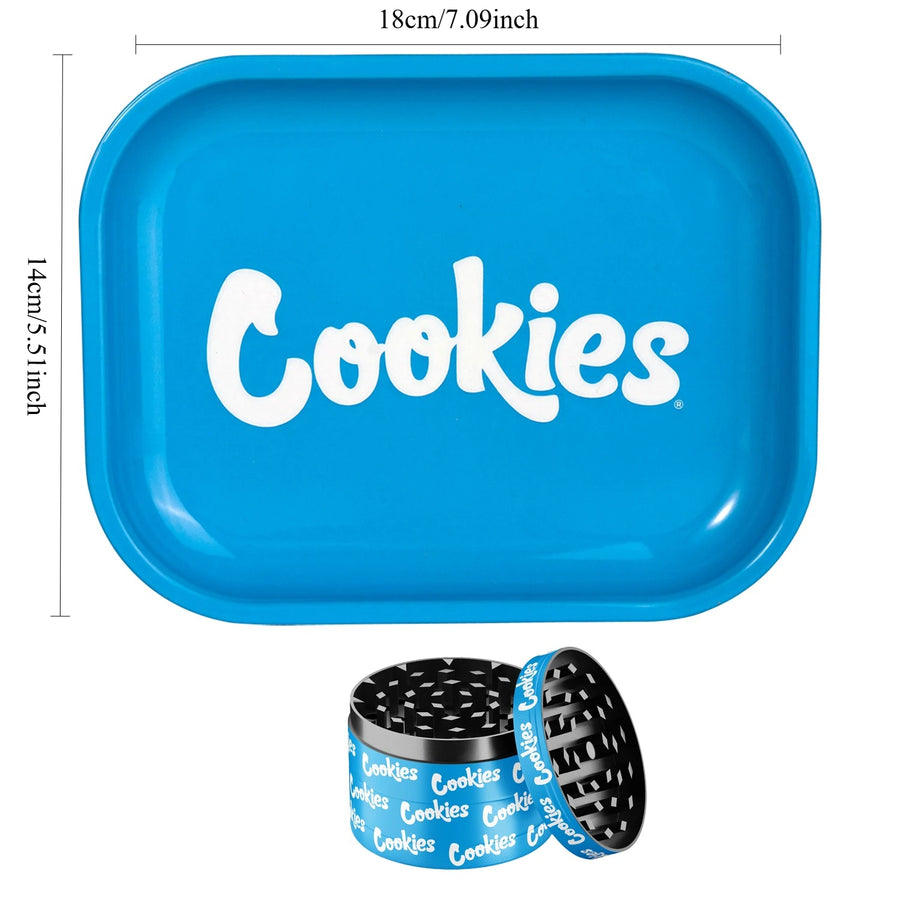Blue tray with 'Cookies' branding and a black and blue herb grinder on a white background