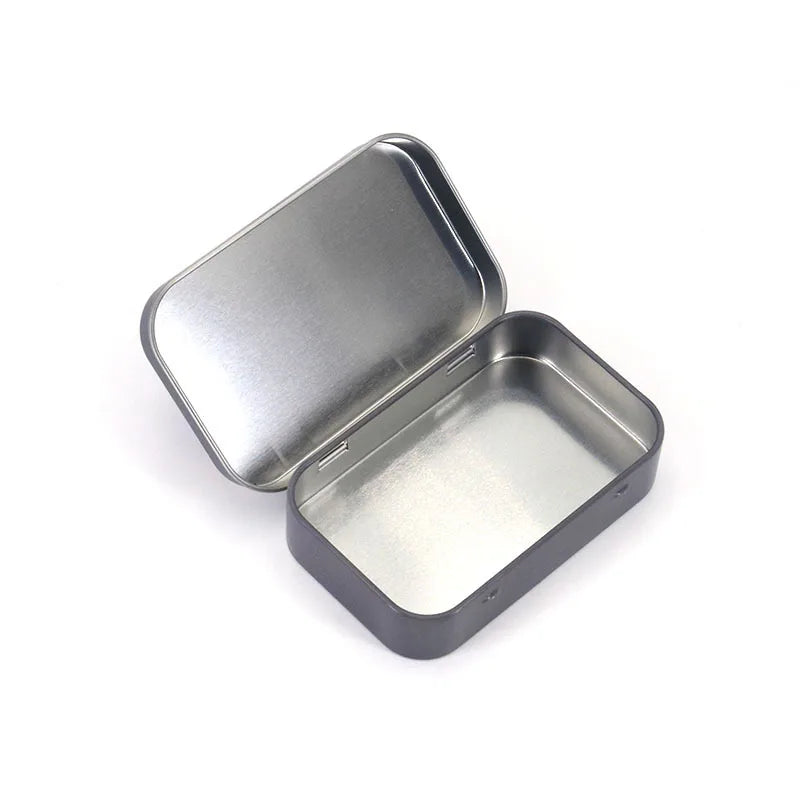 Metallic rectangular tin with lid on a white background