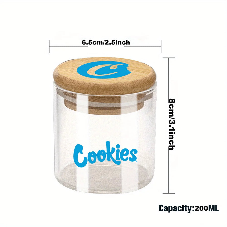 Clear jar with wooden lid labeled 'Cookies' and measurements on a white background
