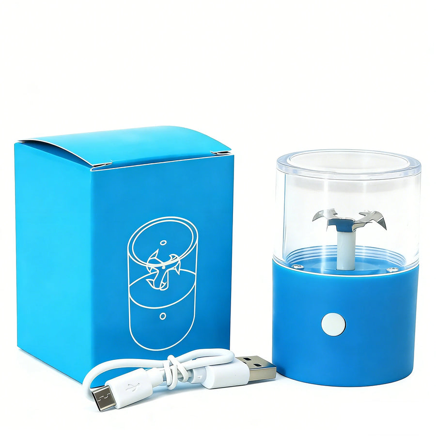 A small blue electric blender base with a clear cup and white blades, shown next to its blue retail box and a white USB charging cable on a white background.