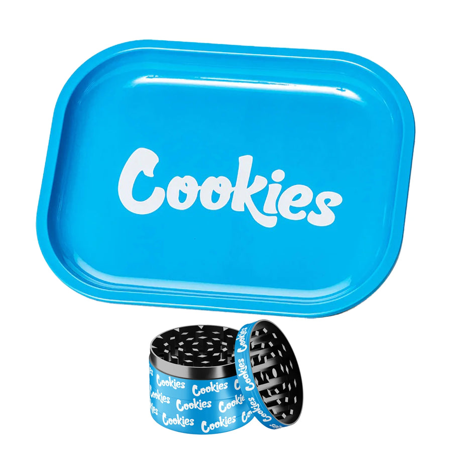 Blue tray with 'Cookies' branding, accompanied by a black and blue herb grinder on a white background.